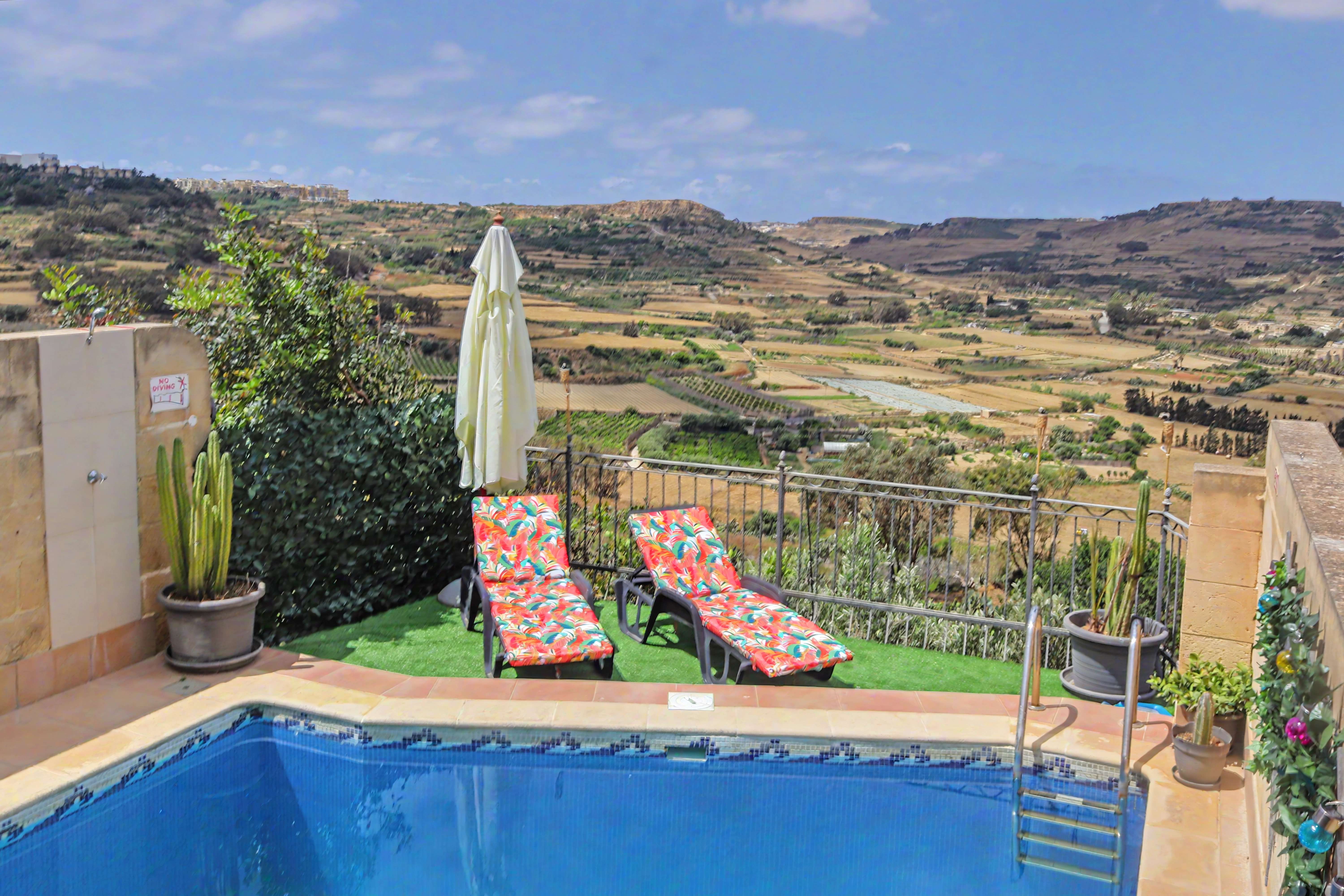 Pool area with sun loungers