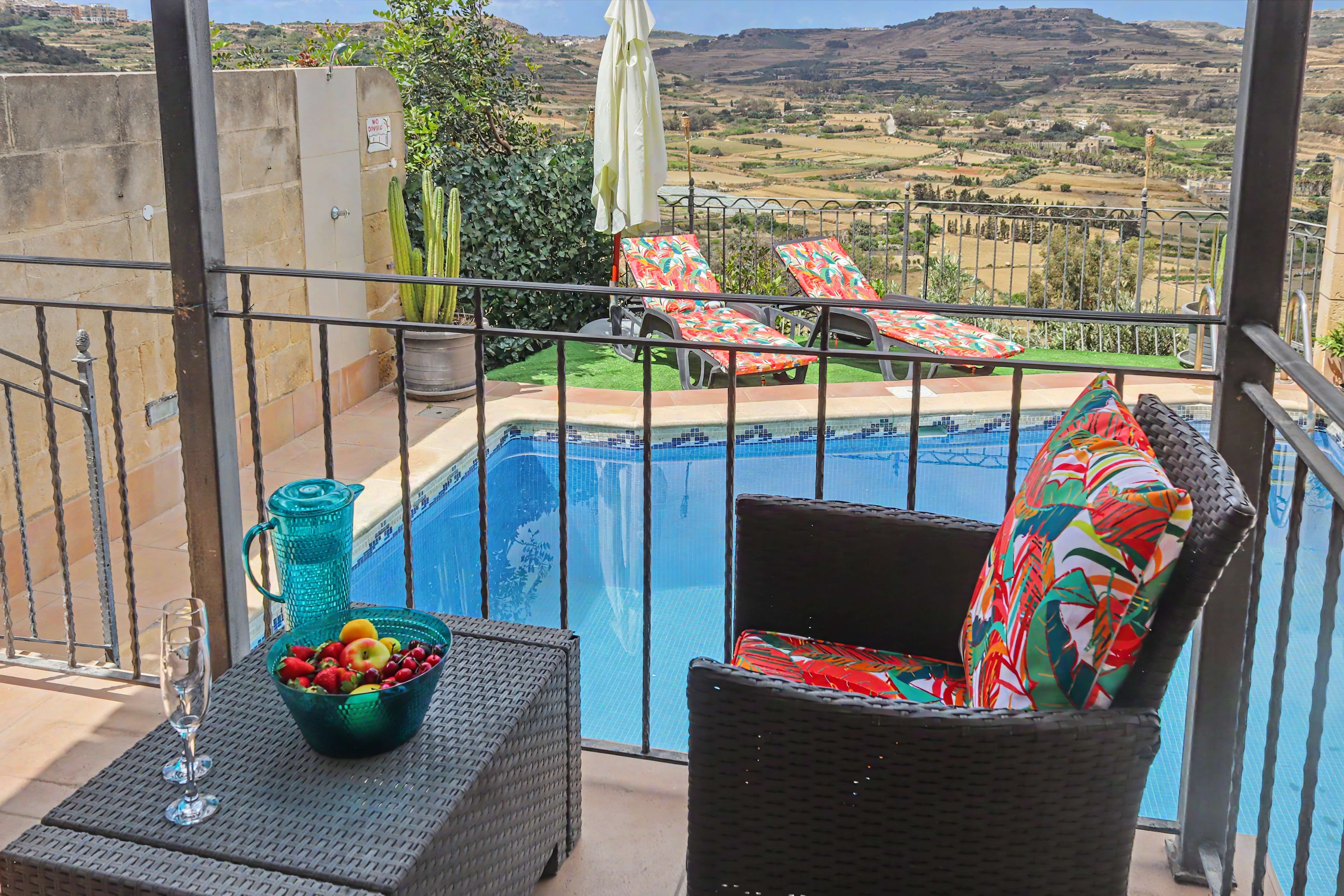 Terrace seating overlooking pool