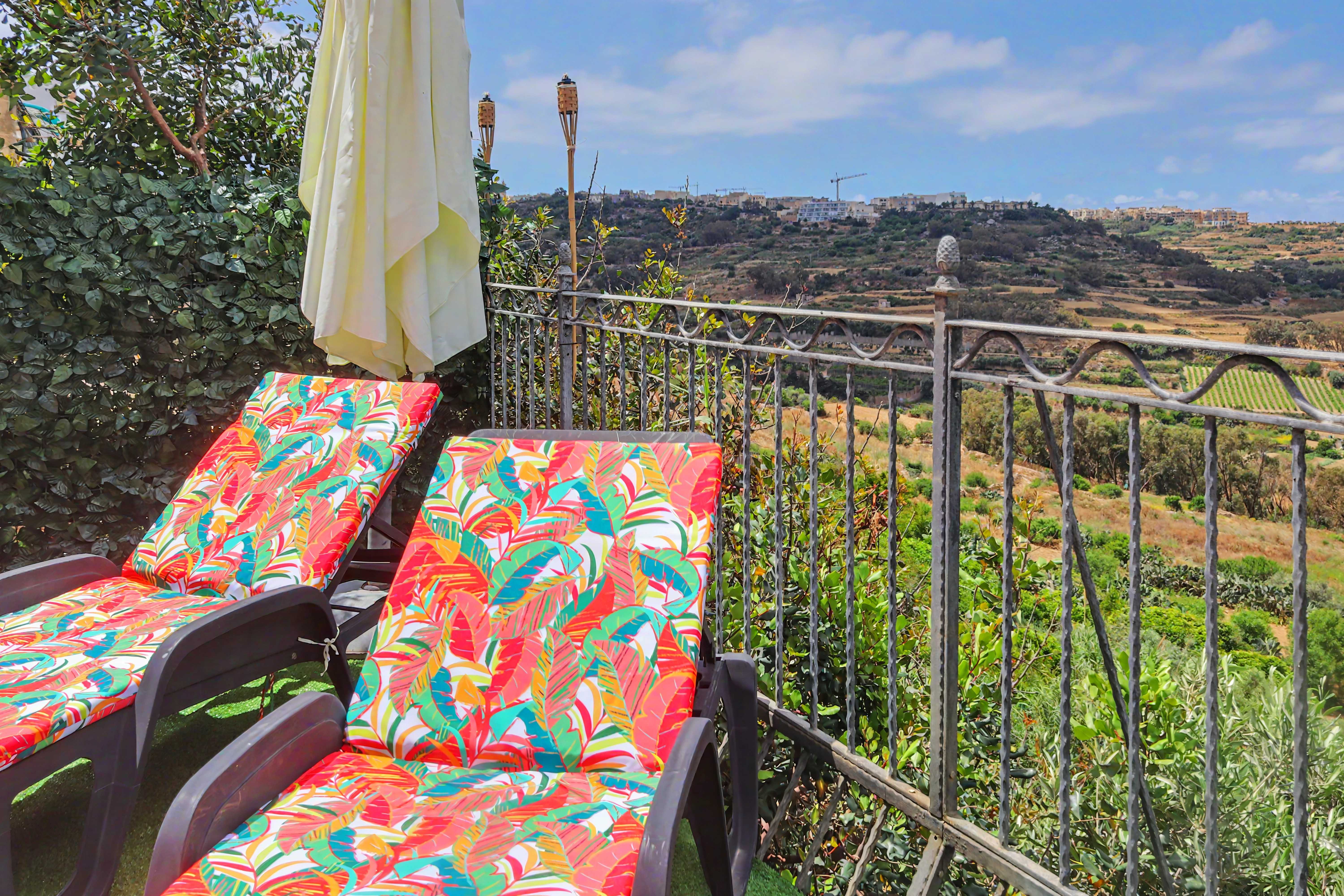 Terrace with sun loungers