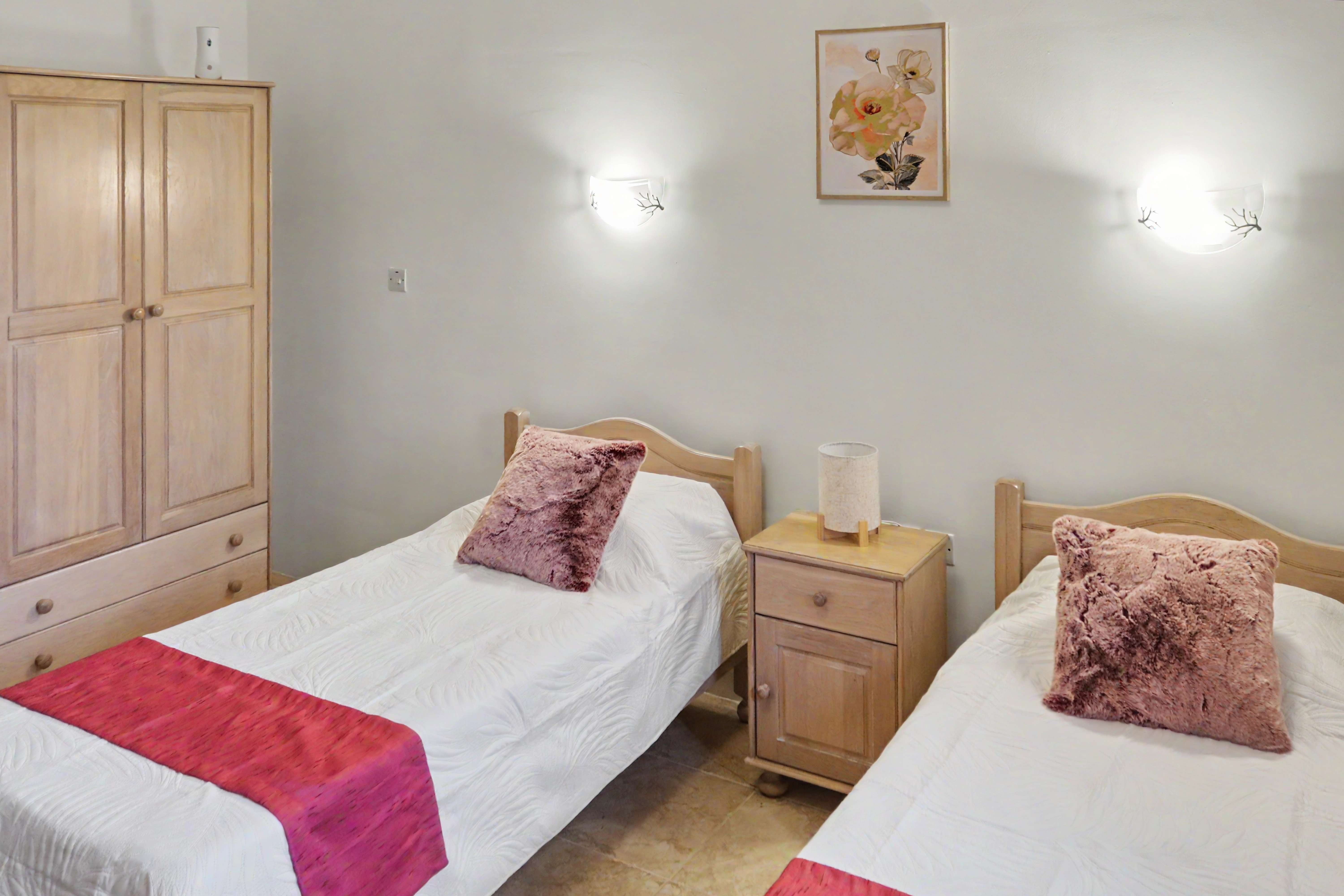 Twin bedroom with wardrobe