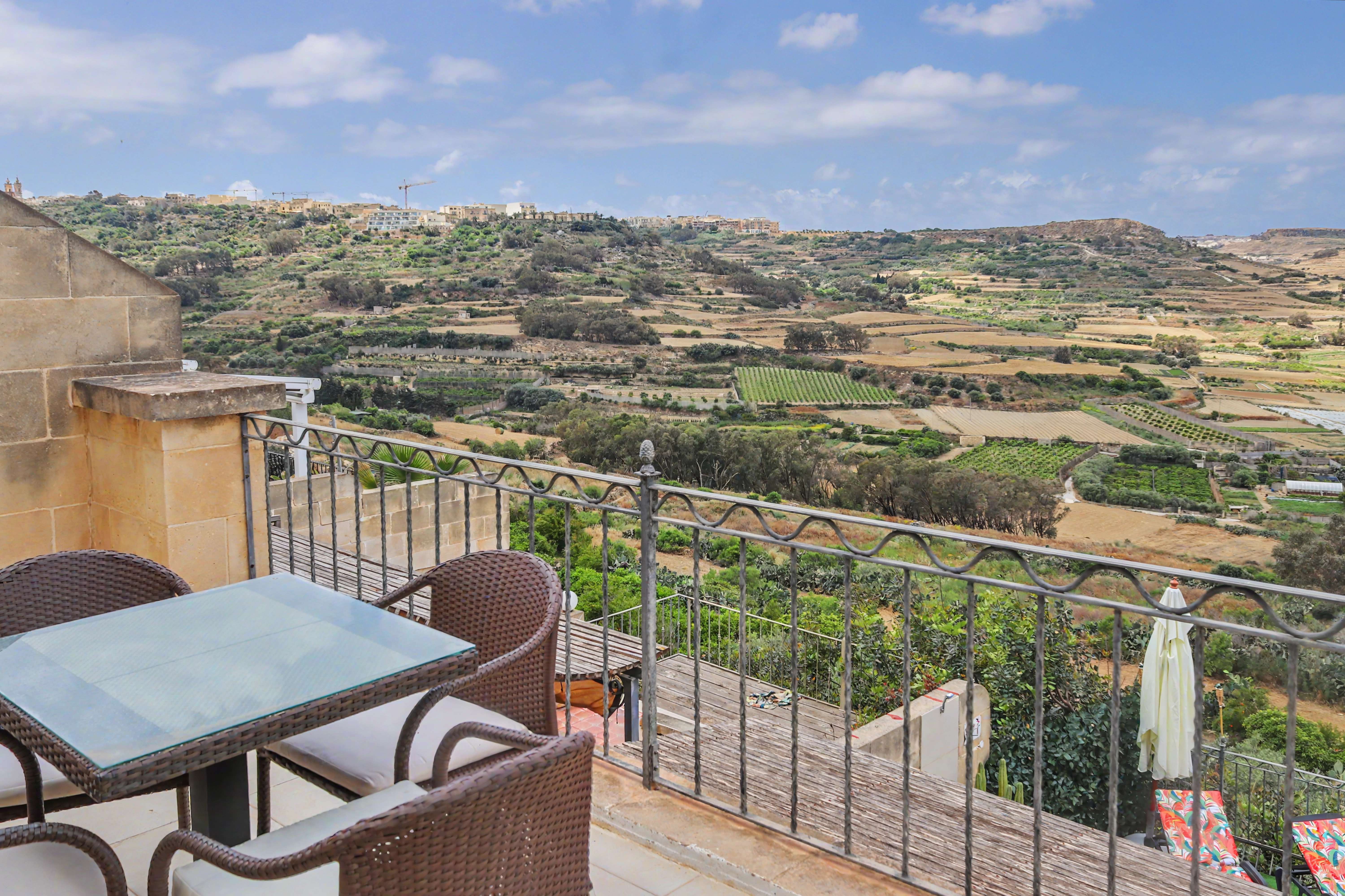 Outdoor dining terrace valley view
