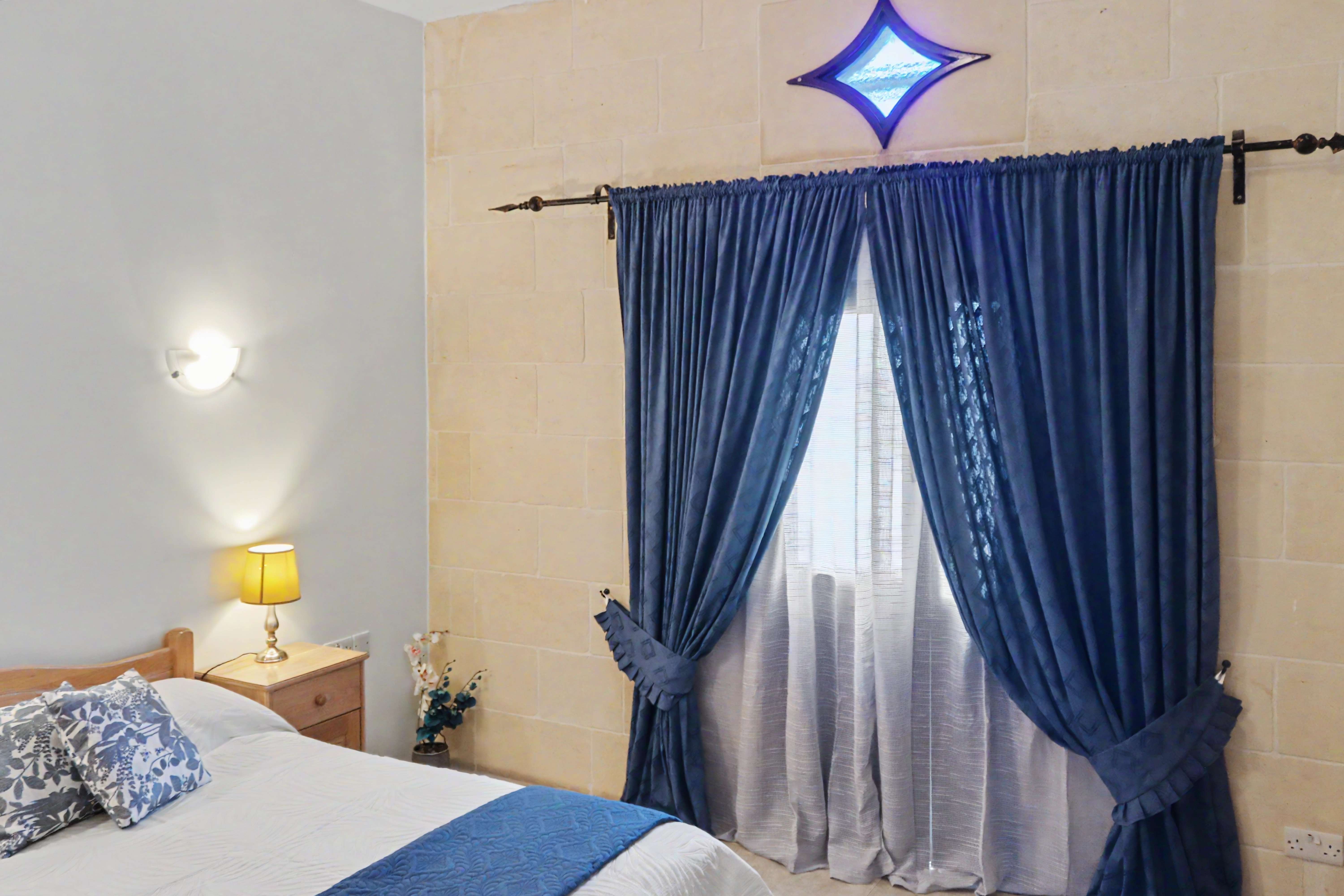 Bedroom with stone accent wall