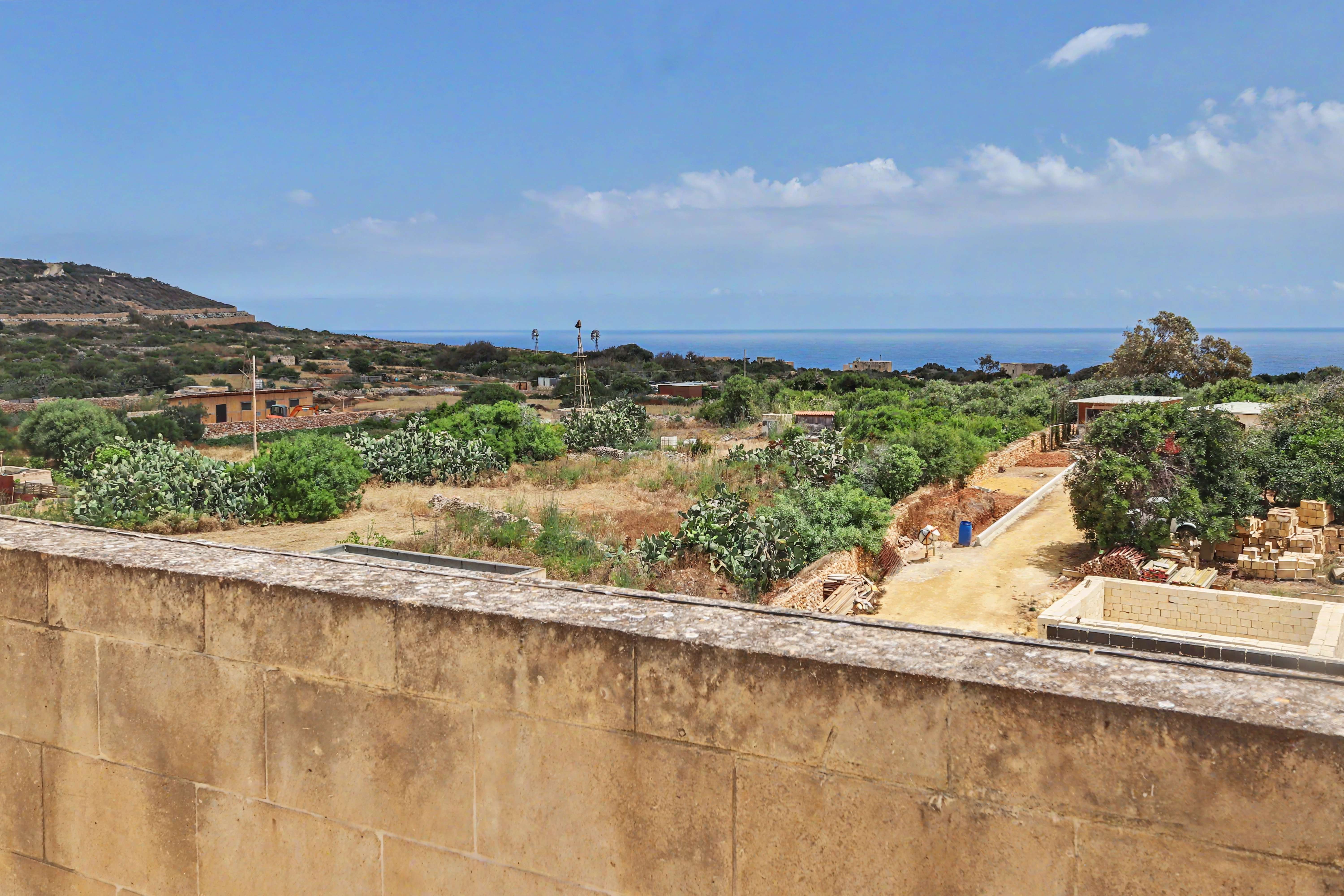 Terrace overlooking sea and hills