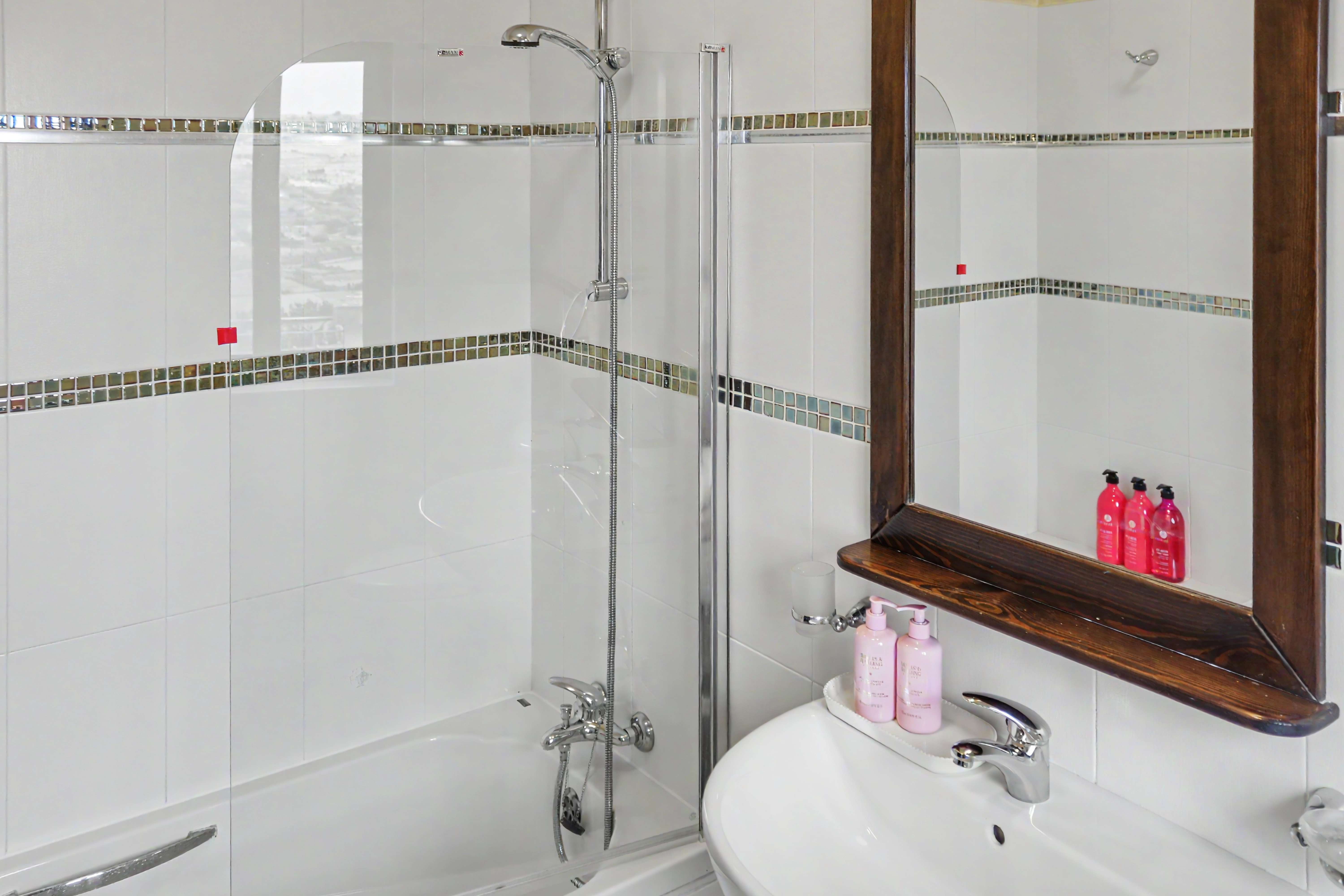 Bathroom with bathtub shower